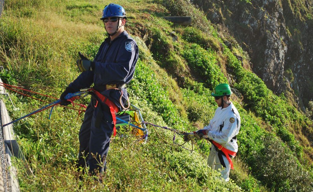 GOAT RESCUE: National Parks and Wildlife officers prepare to ascend to rescue the last remaining goat on Byron headland. GOAT RESCUE: National Parks and Wildlife officers prepare to ascend to rescue the last remaining goat on Byron headland.
